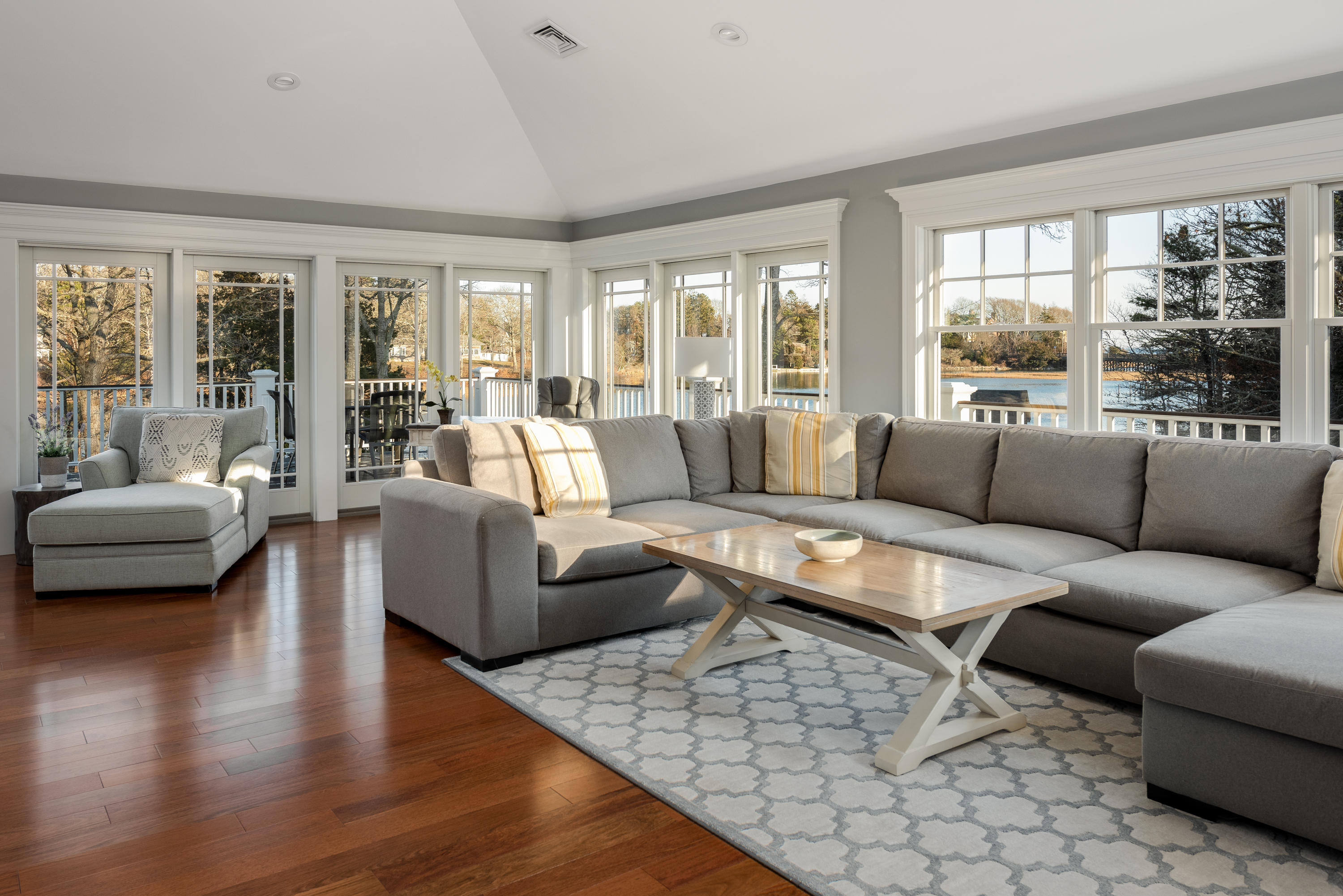 94 Starboard Lane Osterville, MA 02655 - Photo 12 of 47 a living room with furniture and a large window
