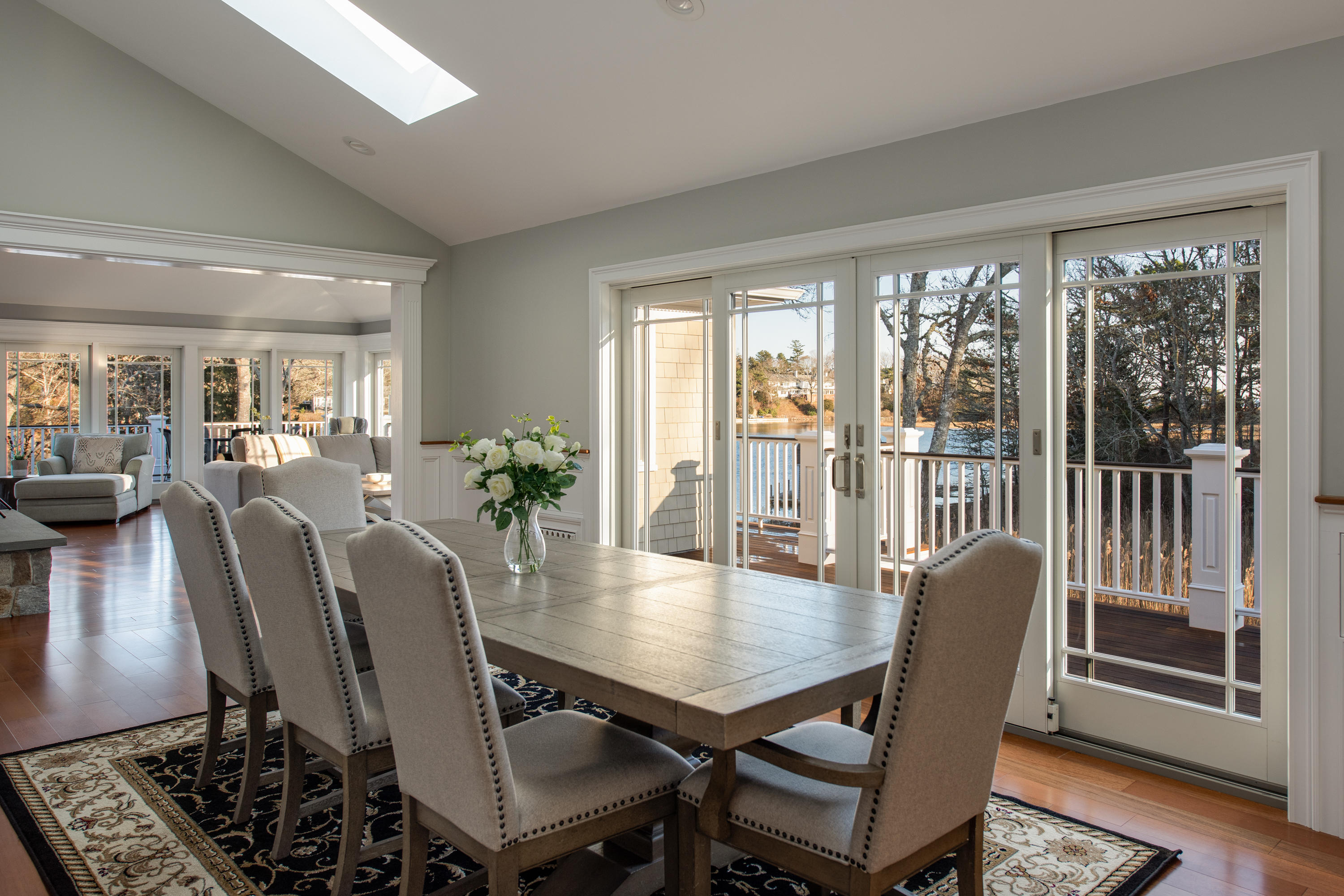 94 Starboard Lane Osterville, MA 02655 - Photo 14 of 47 a view of a dining room with furniture window and wooden floor
