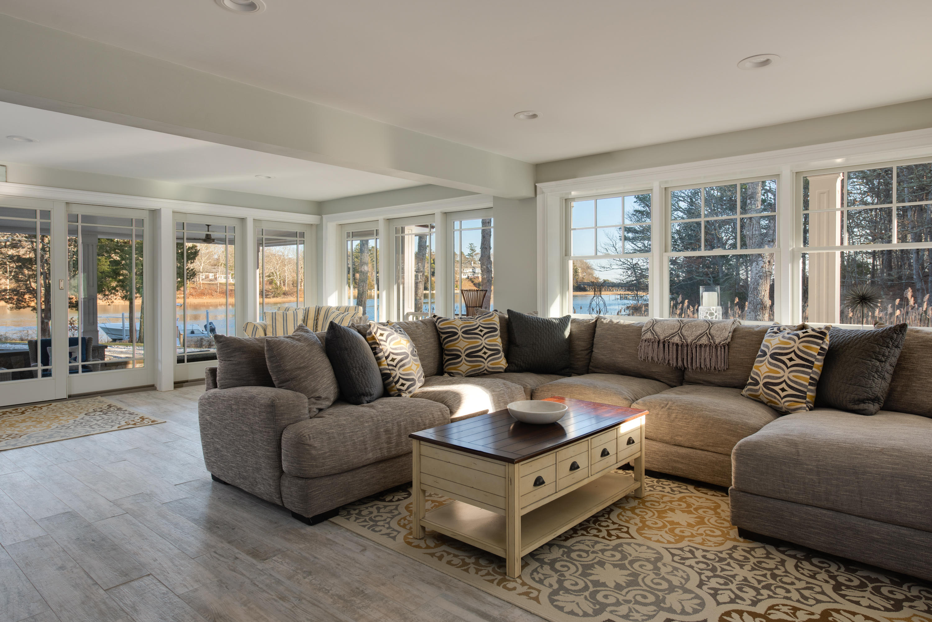 94 Starboard Lane Osterville, MA 02655 - Photo 24 of 47 a living room with furniture and a large window