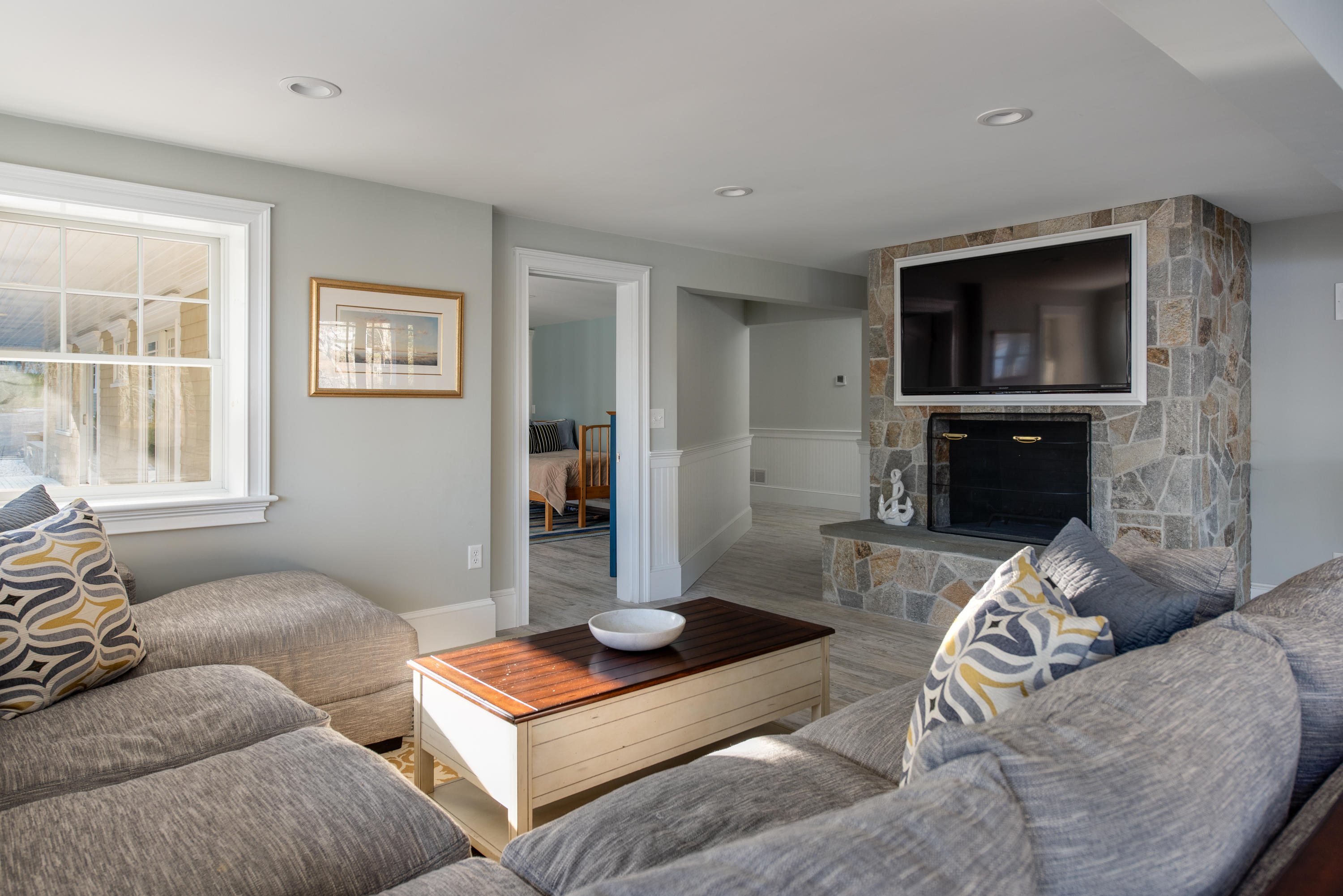 94 Starboard Lane Osterville, MA 02655 - Photo 25 of 47 a living room with furniture and a flat screen tv