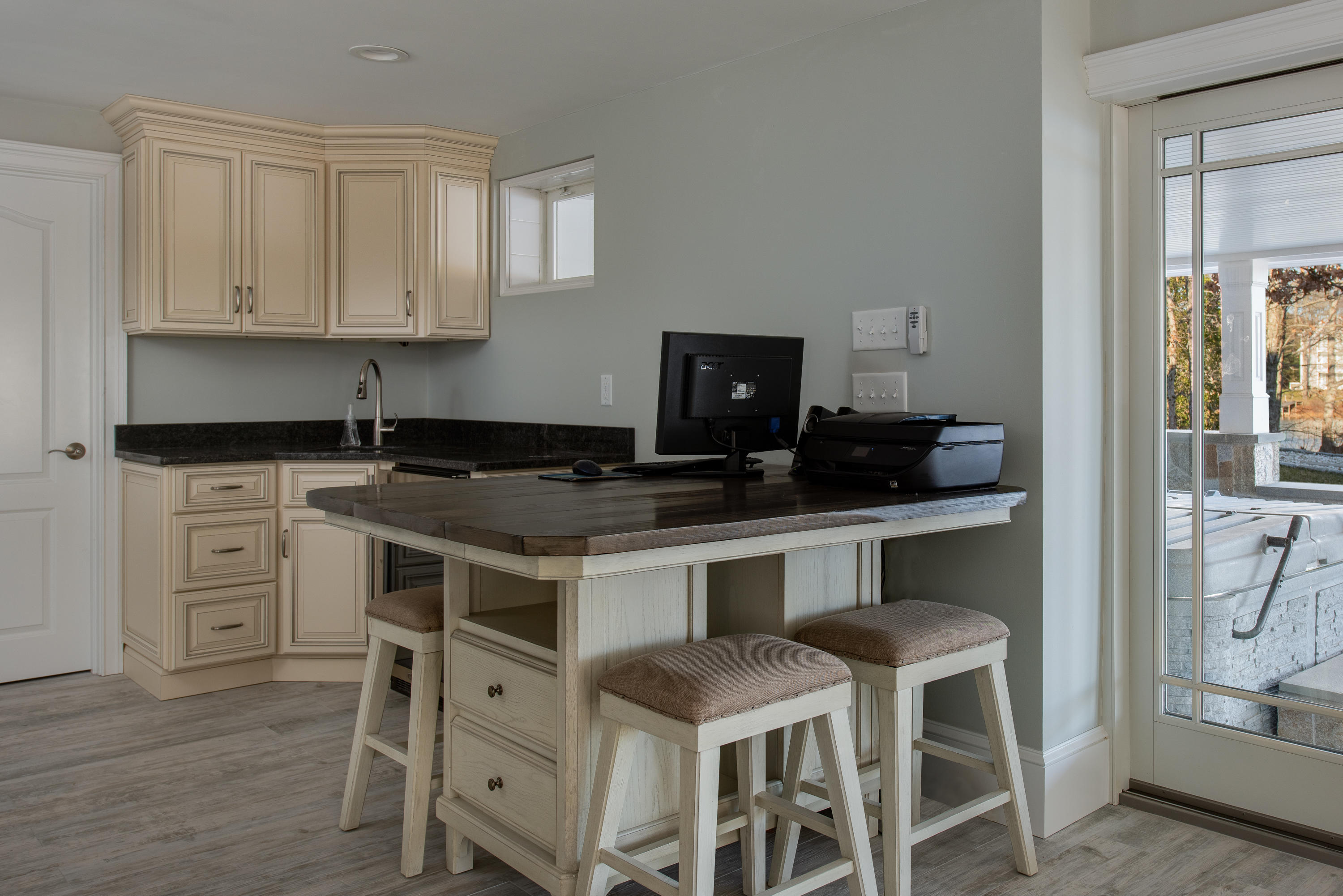 94 Starboard Lane Osterville, MA 02655 - Photo 28 of 47 a kitchen with white cabinets and chairs