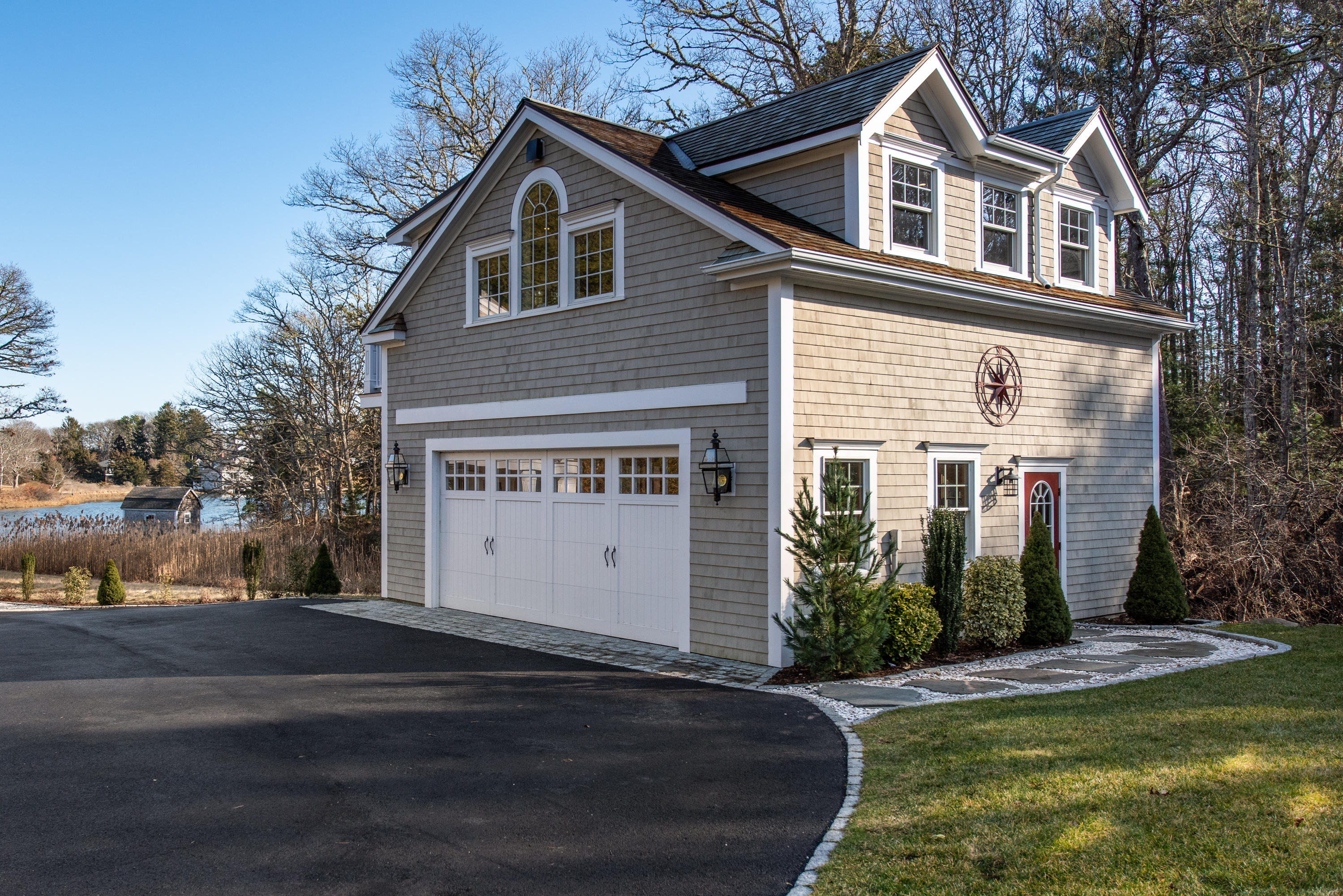 94 Starboard Lane Osterville, MA 02655 - Photo 29 of 47 a front view of a house with a yard