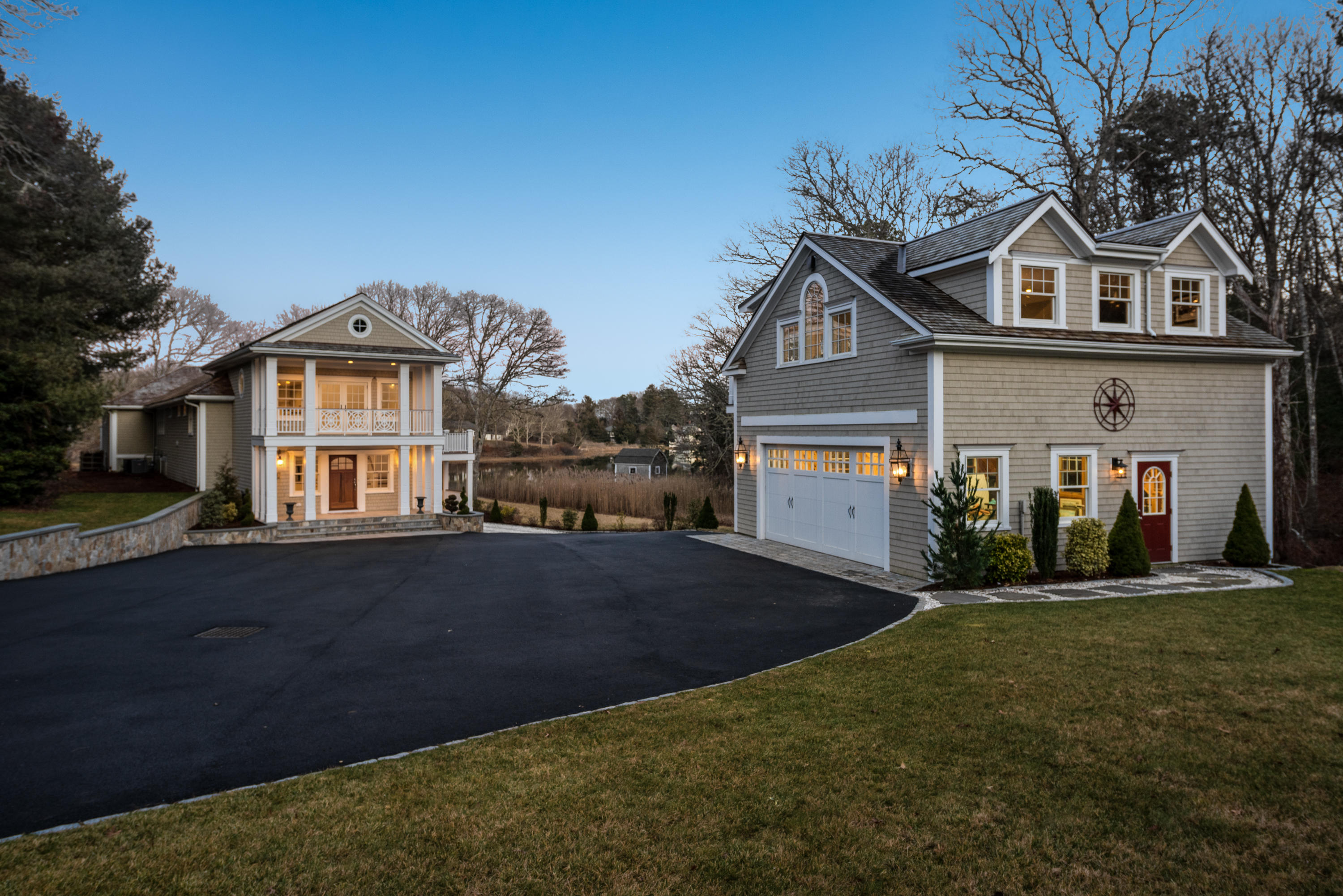 94 Starboard Lane Osterville, MA 02655 - Photo 32 of 47 a front view of a house with a yard