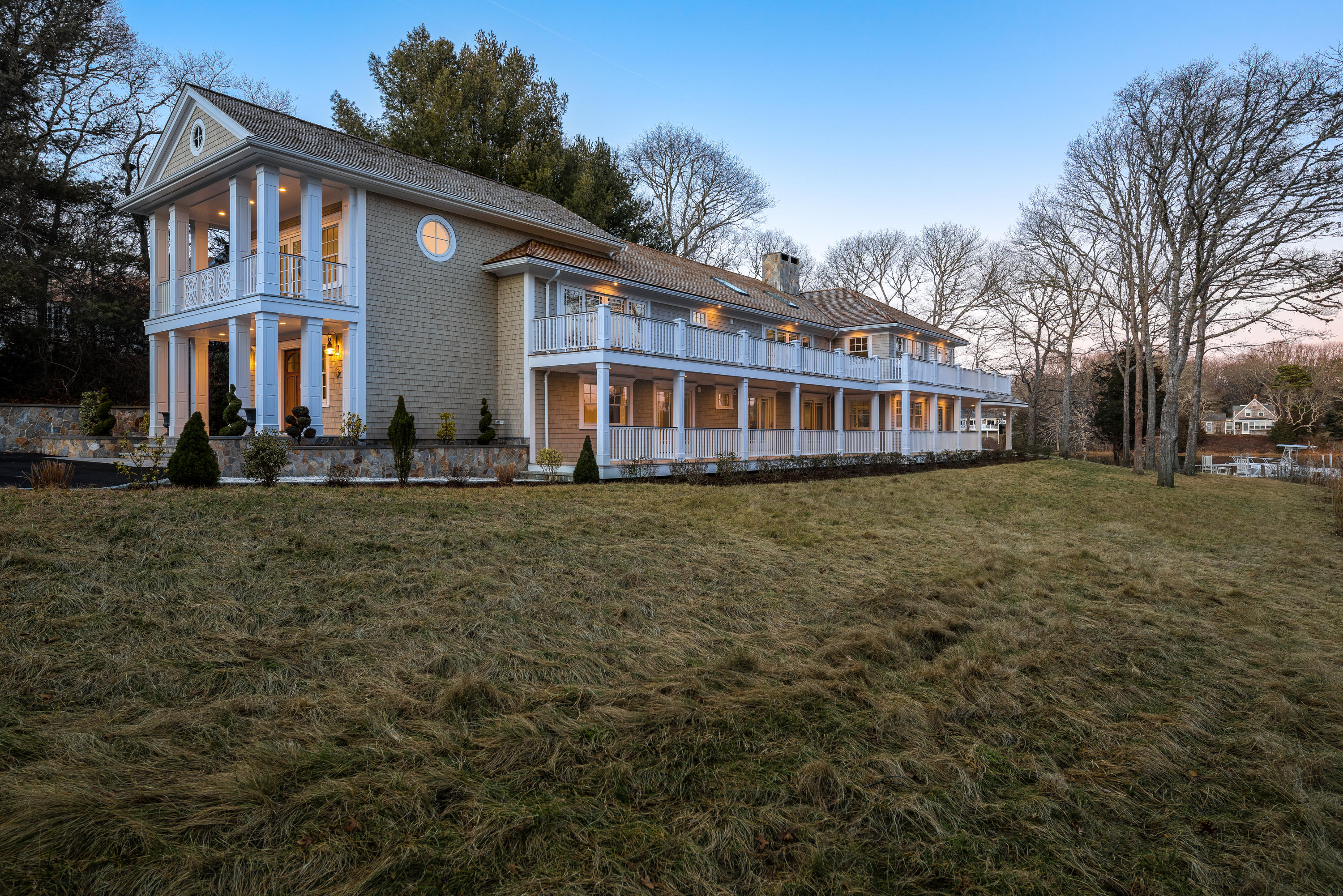 94 Starboard Lane Osterville, MA 02655 - Photo 33 of 47 a front view of a house with a yard and trees