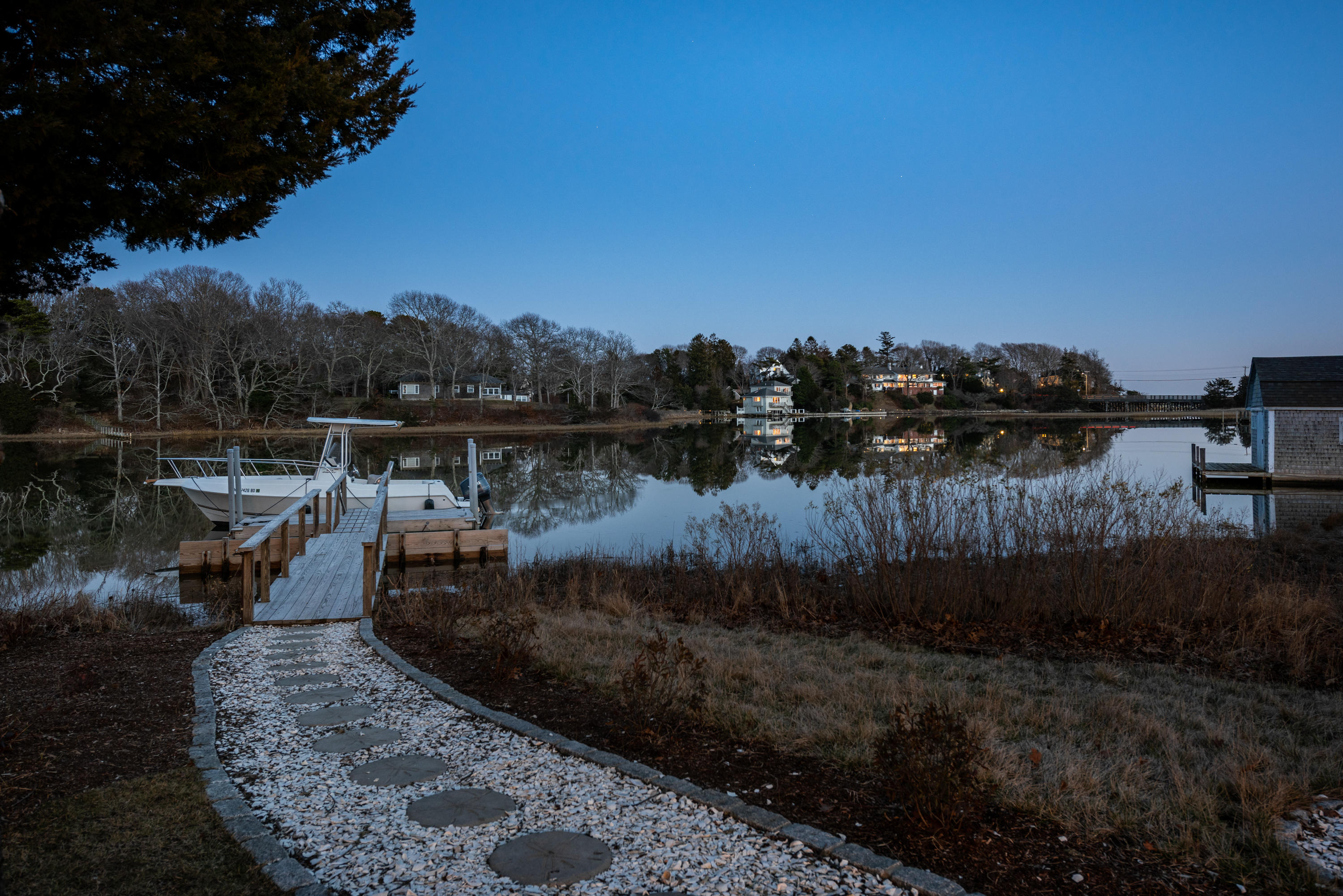 94 Starboard Lane Osterville, MA 02655 - Photo 36 of 47 a view of a lake with a mountain in the background