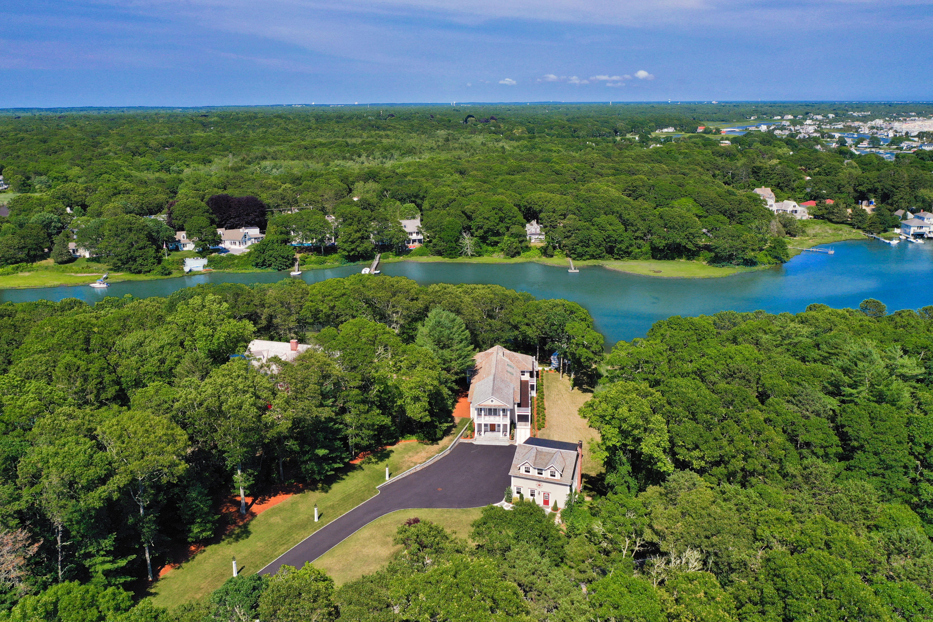 94 Starboard Lane Osterville, MA 02655 - Photo 45 of 47 an aerial view of a house with a yard and lake view