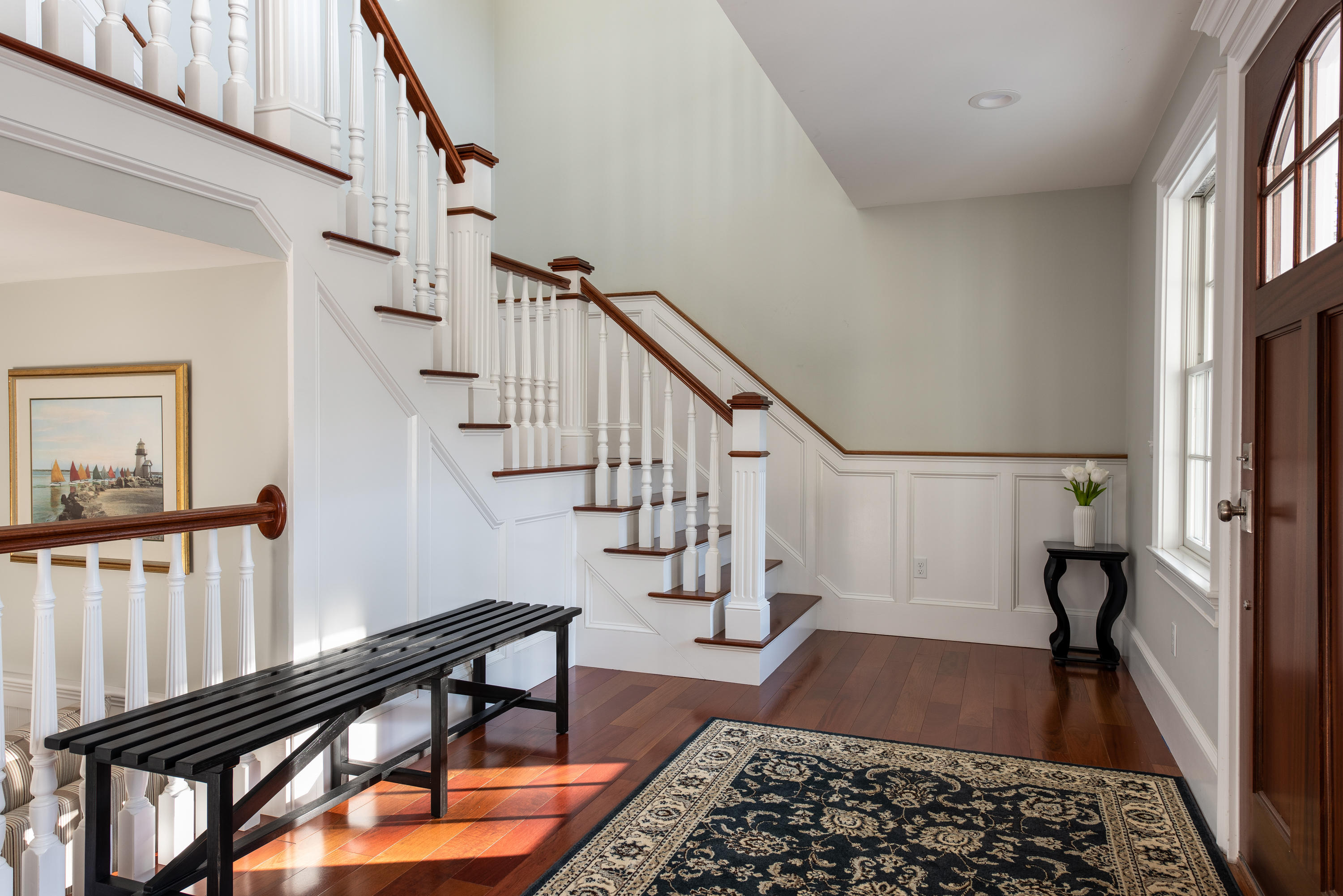 94 Starboard Lane Osterville, MA 02655 - Photo 10 of 47 a view of entryway with wooden floor and a rug