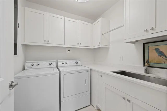 a view of storage and utility room with washer and dryer
