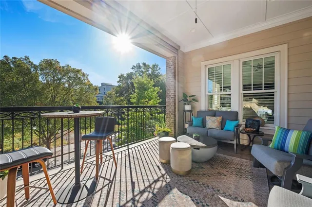 a view of a balcony with furniture
