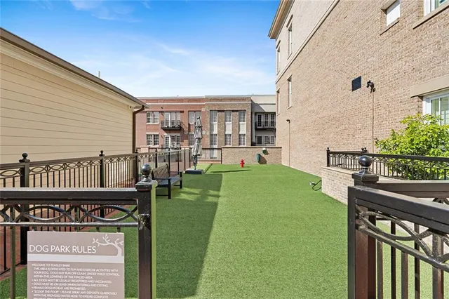 a view of a chairs and table in the balcony