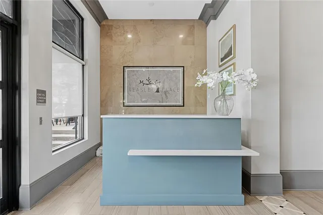 a view of a hallway with paintings on the wall