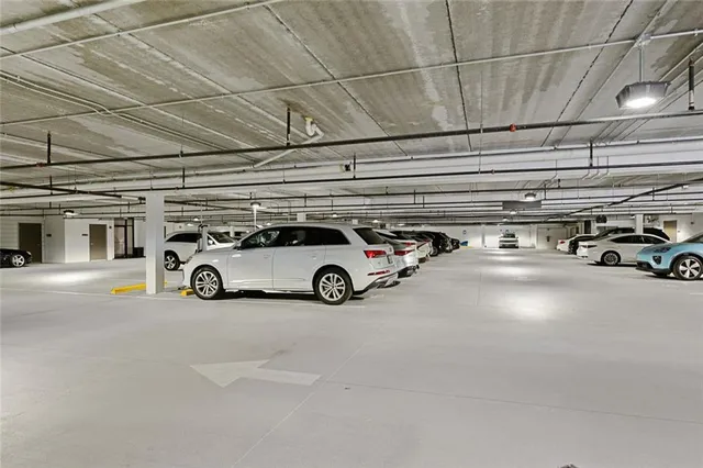 a view of parking garage with cars