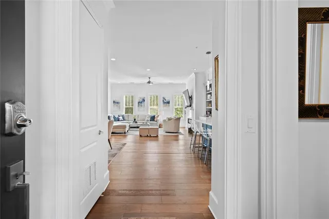 a view of living room with furniture and wooden floor