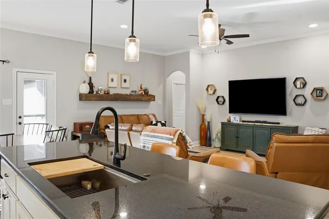 a living room with furniture and a flat screen tv