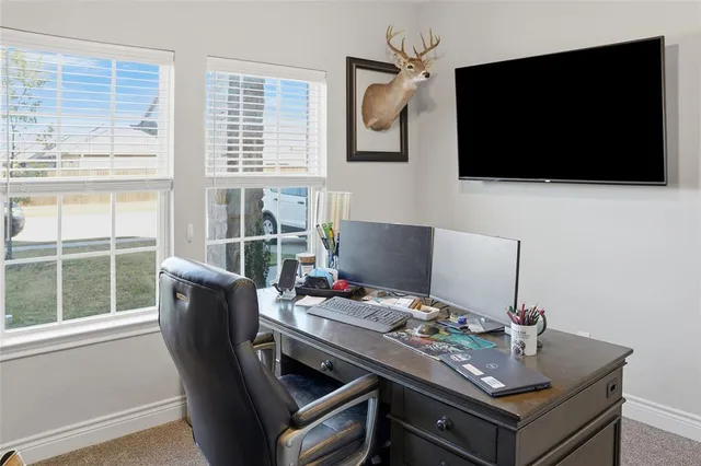 a view of a workspace with furniture