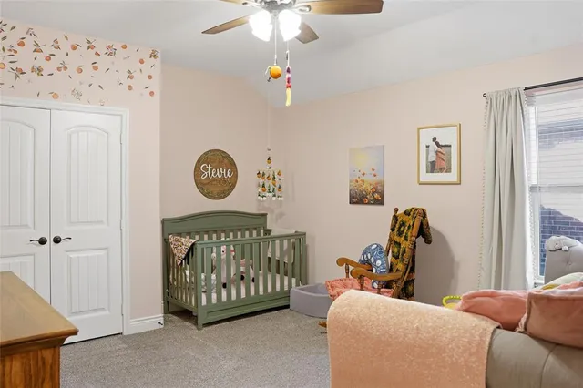 a bedroom with a bed and a couch