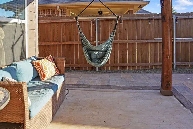 a view of a house with a backyard and porch