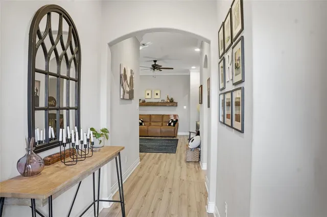 a dining room with furniture and wooden floor