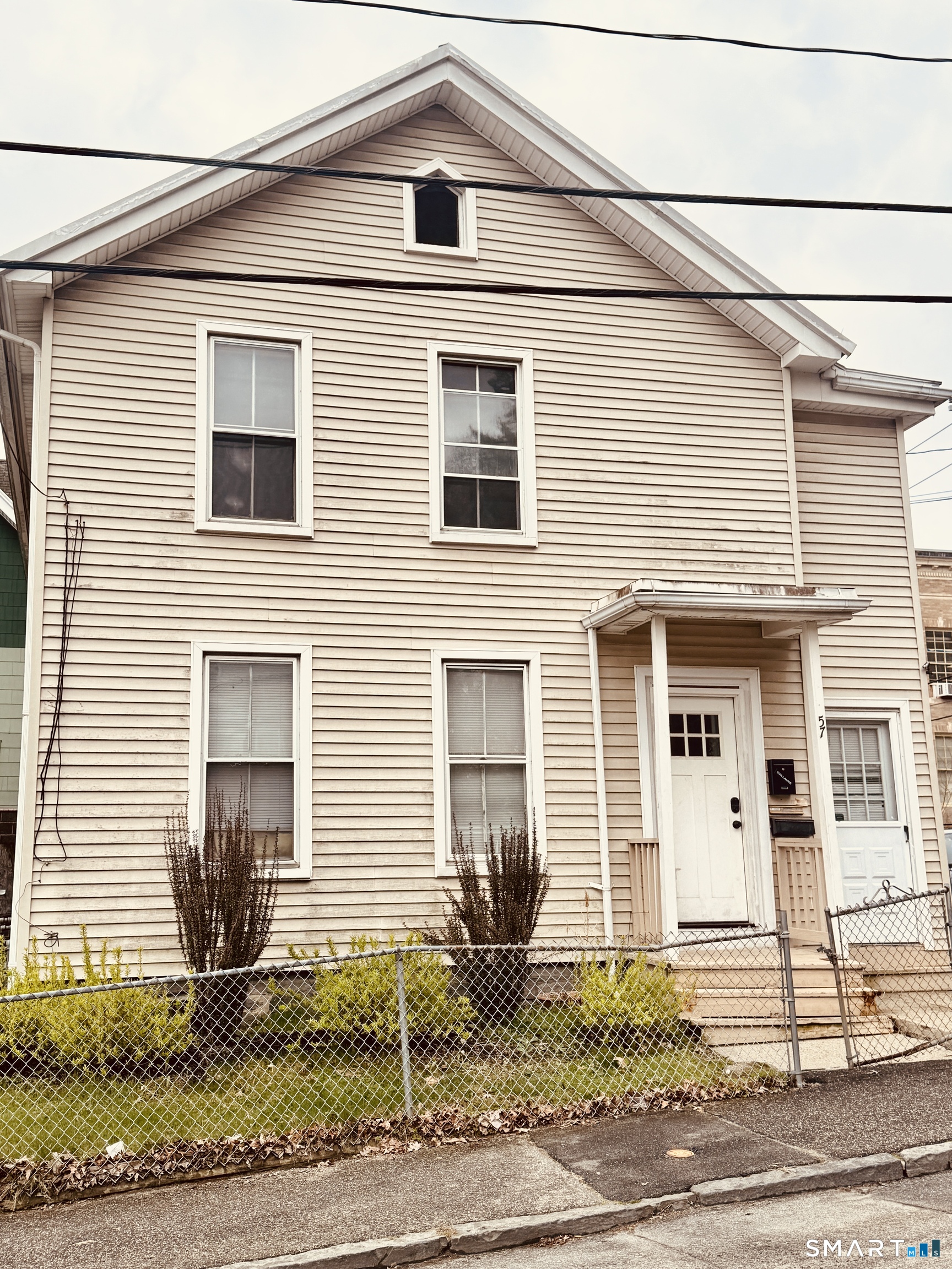 59 Green Street Waterbury, CT 06708 - Photo 6 of 6 a front view of a house with garden