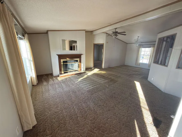 a view of livingroom with fireplace and window