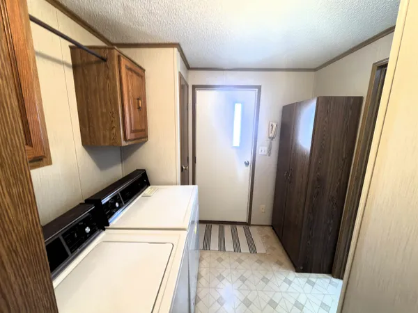 a view of an empty room with a fireplace
