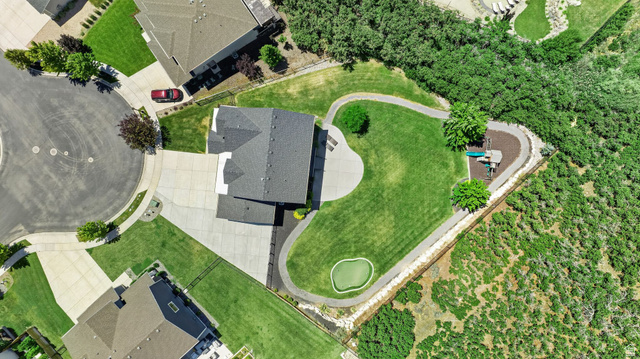 6536 West Muirfield Road Highland, UT 84003 - Photo 48 of 48 Expansive property featuring a large lawn, integrated putting green, and a winding pathway