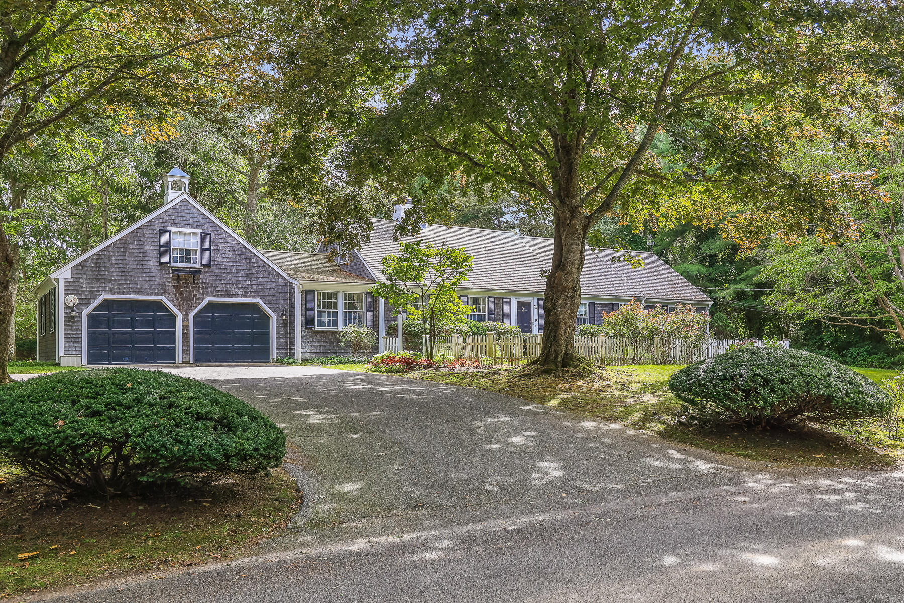 73 Hathaway Road Osterville, MA 02655 - Photo 1 of 28 a front view of a house with a yard and garage