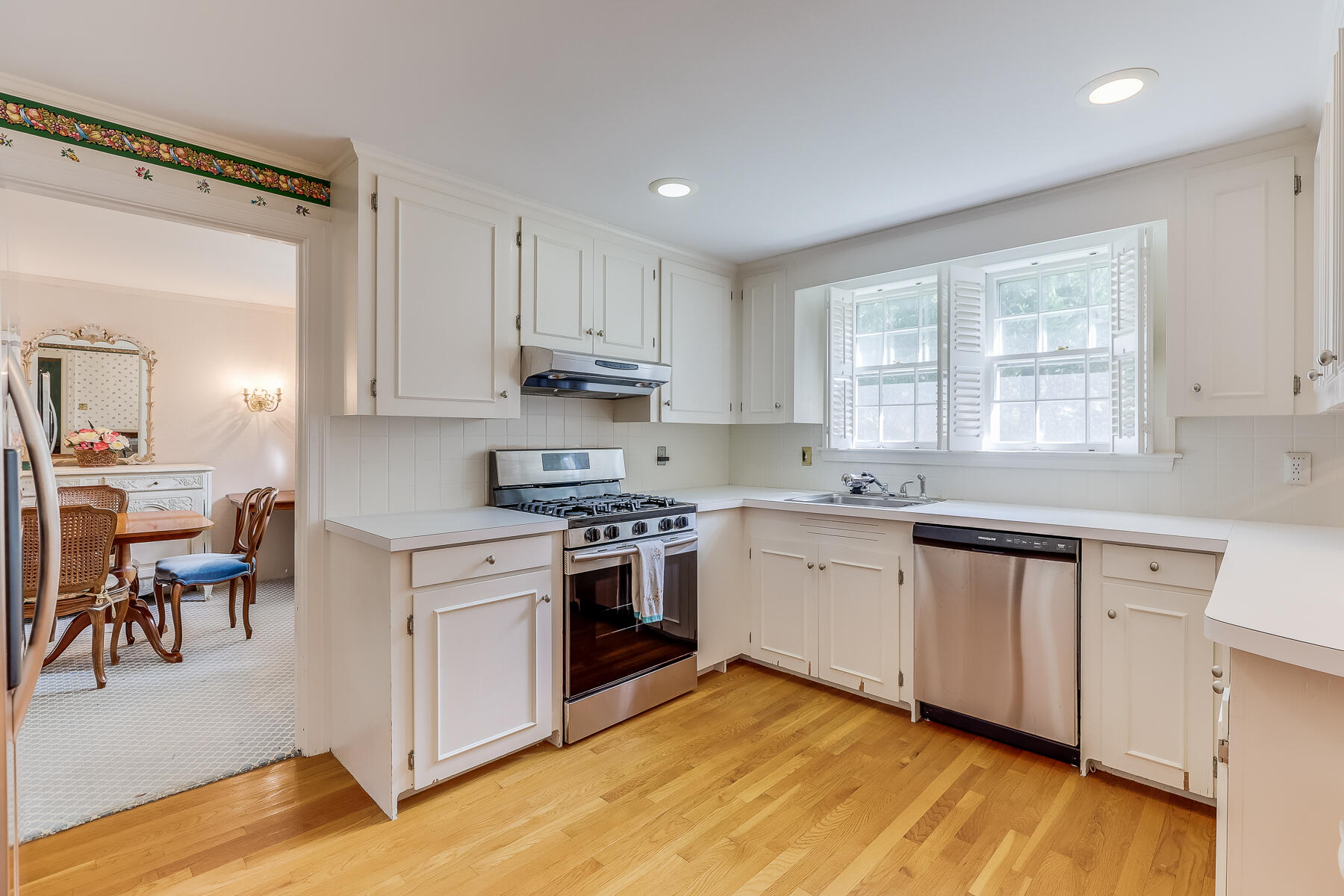 73 Hathaway Road Osterville, MA 02655 - Photo 8 of 28 a kitchen with granite countertop white cabinets and white appliances