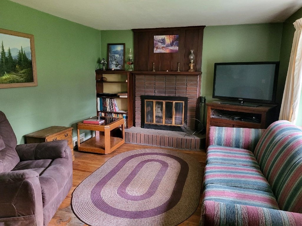 144 Washington Road Brimfield, MA 01010 - Photo 8 of 21 a living room with furniture and a flat screen tv