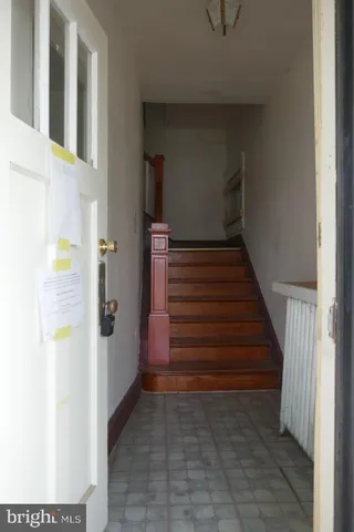 a kitchen with a sink a toilet and cabinets