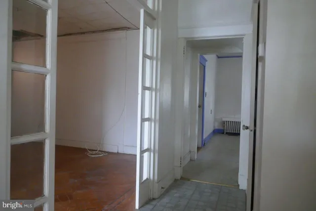 a view of a hallway with a room space