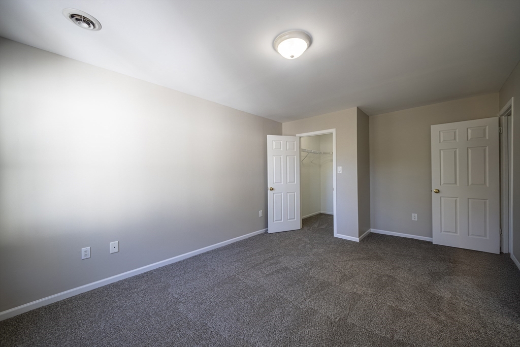 357 Boylston Street, Unit 3 Lowell, MA 01852 - Photo 19 of 35 an empty room with an entryway