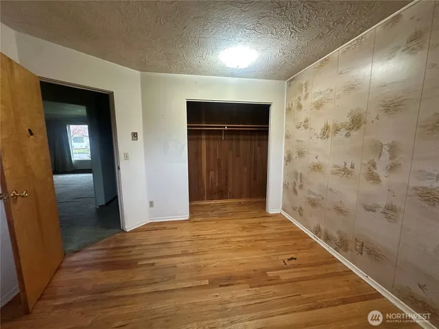 wooden floor and closet in a bathroom
