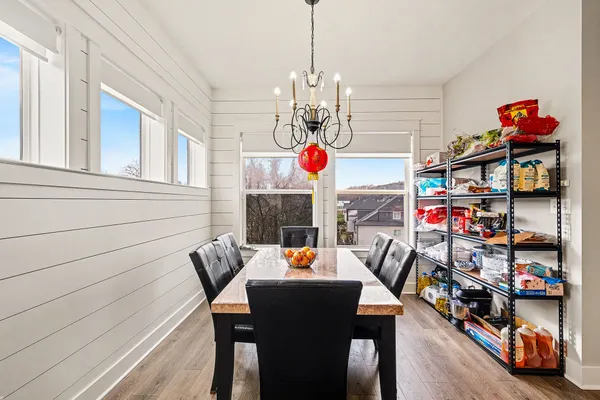 a view of a dining room with furniture and a kitchen