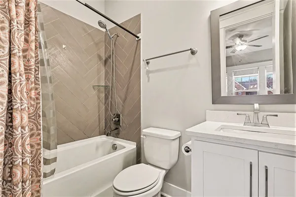 a bathroom with a sink a toilet and a bathtub