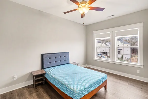 a bedroom with a bed and a window