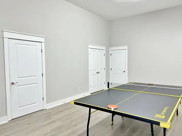 an empty room with wooden floor