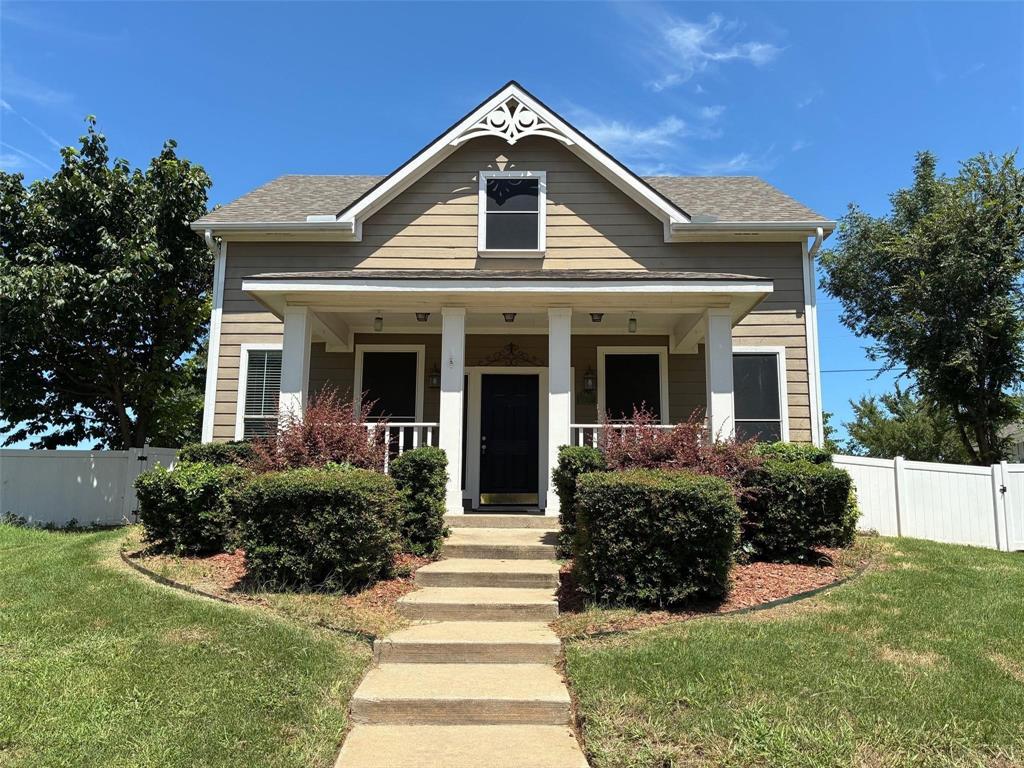 9801 Cedarcrest Drive Providence Village, TX 76227 - Photo 1 of 23 a front view of a house with a yard