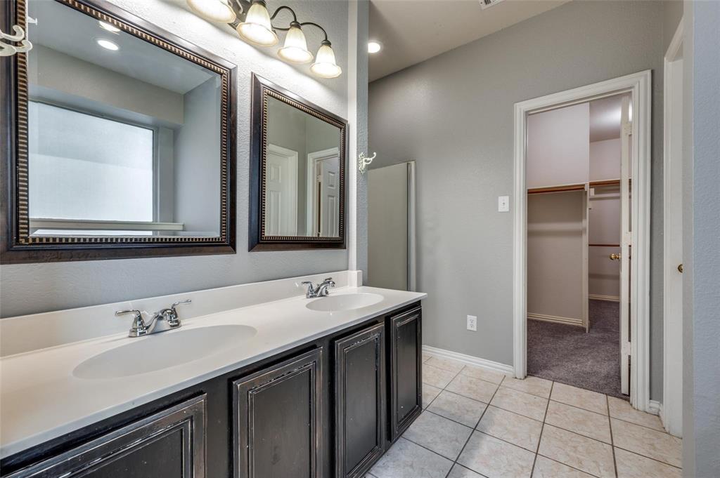 9801 Cedarcrest Drive Providence Village, TX 76227 - Photo 11 of 23 a bathroom with a sink and a mirror
