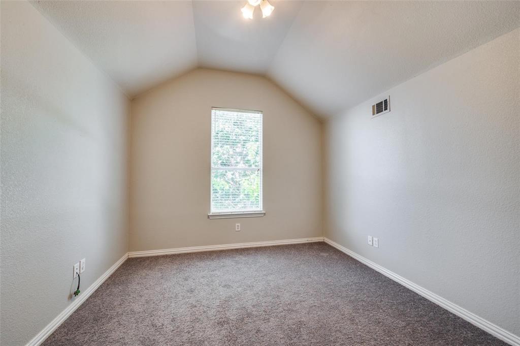 9801 Cedarcrest Drive Providence Village, TX 76227 - Photo 9 of 23 an empty room with a window