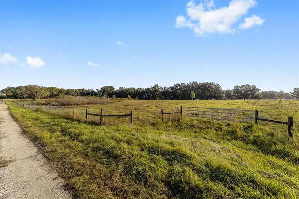 a view of a lake with houses in the back