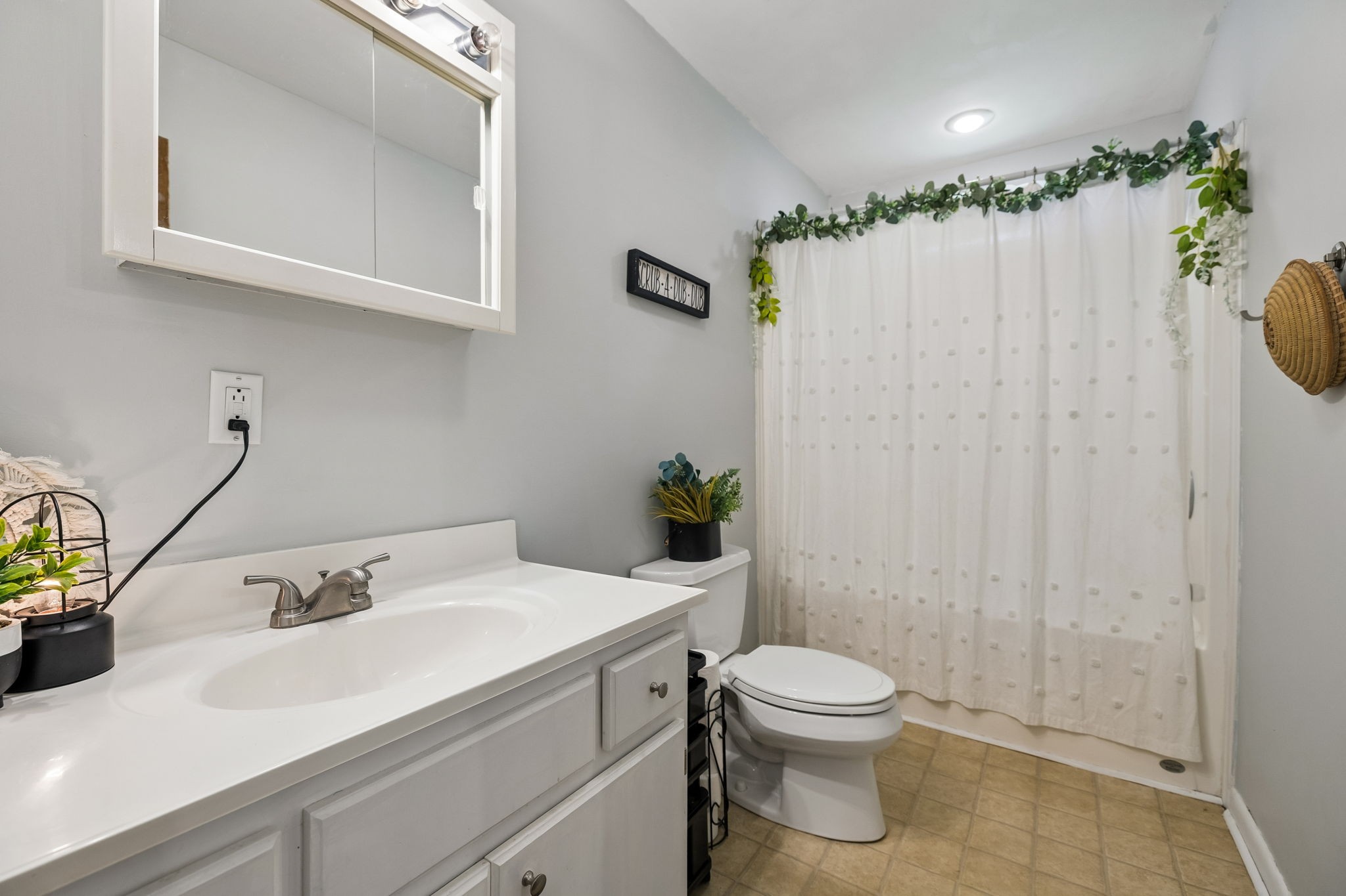 115 1st Street Monteagle, TN 37356 - Photo 11 of 22 a bathroom with a sink a toilet and shower