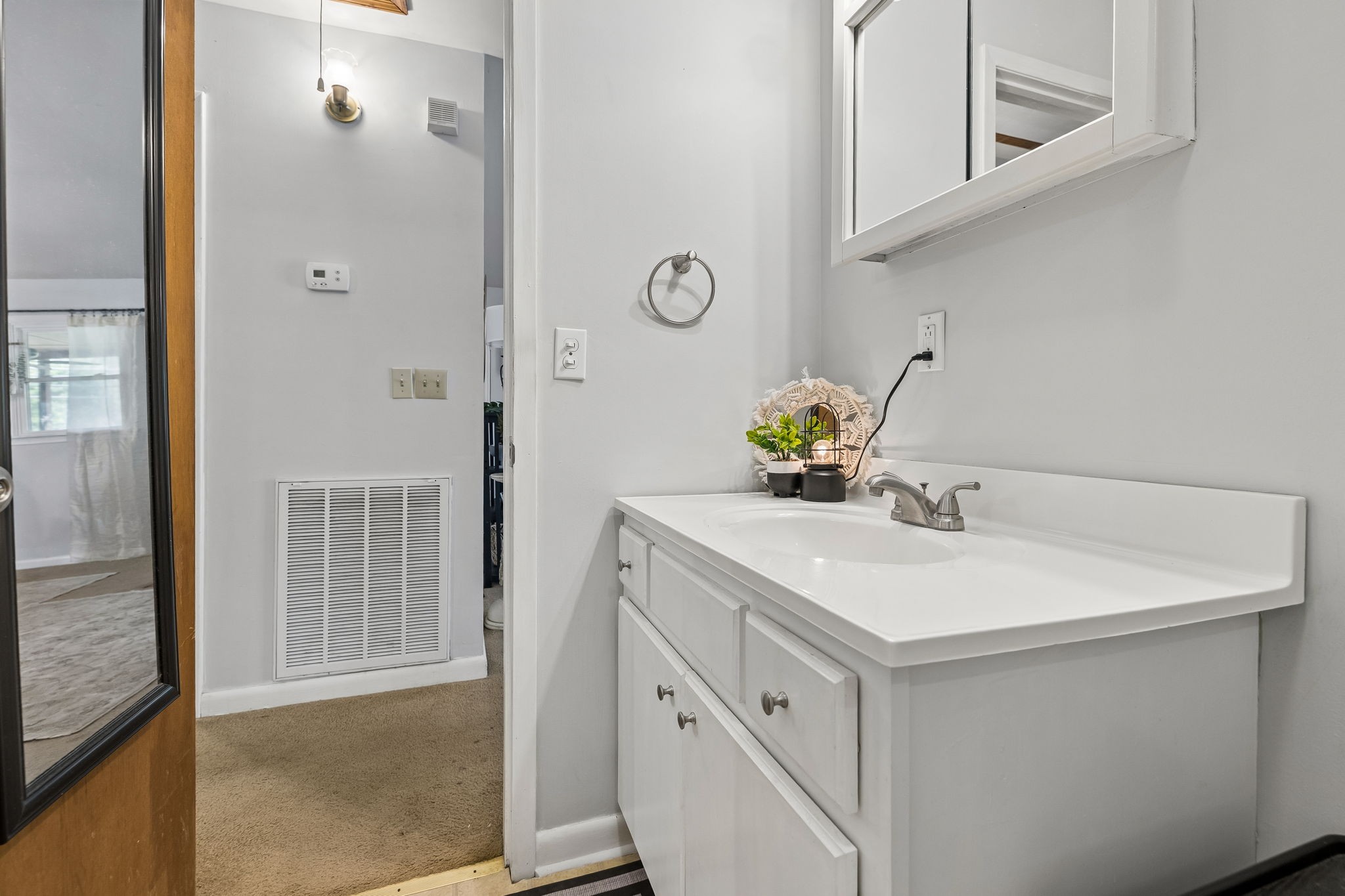 115 1st Street Monteagle, TN 37356 - Photo 12 of 22 a bathroom with a sink vanity and a mirror