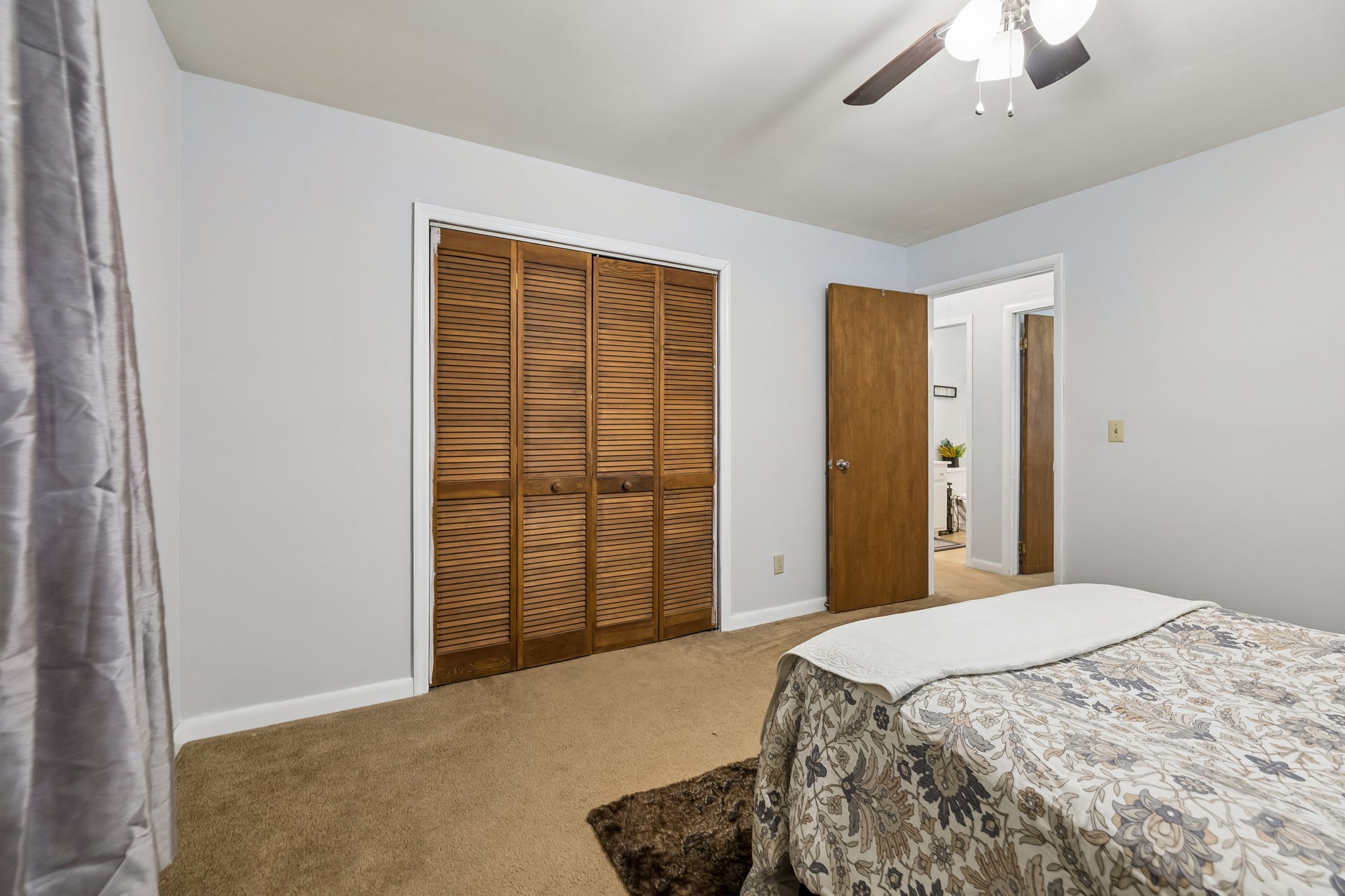 115 1st Street Monteagle, TN 37356 - Photo 14 of 22 a bedroom with a bed and a chandelier