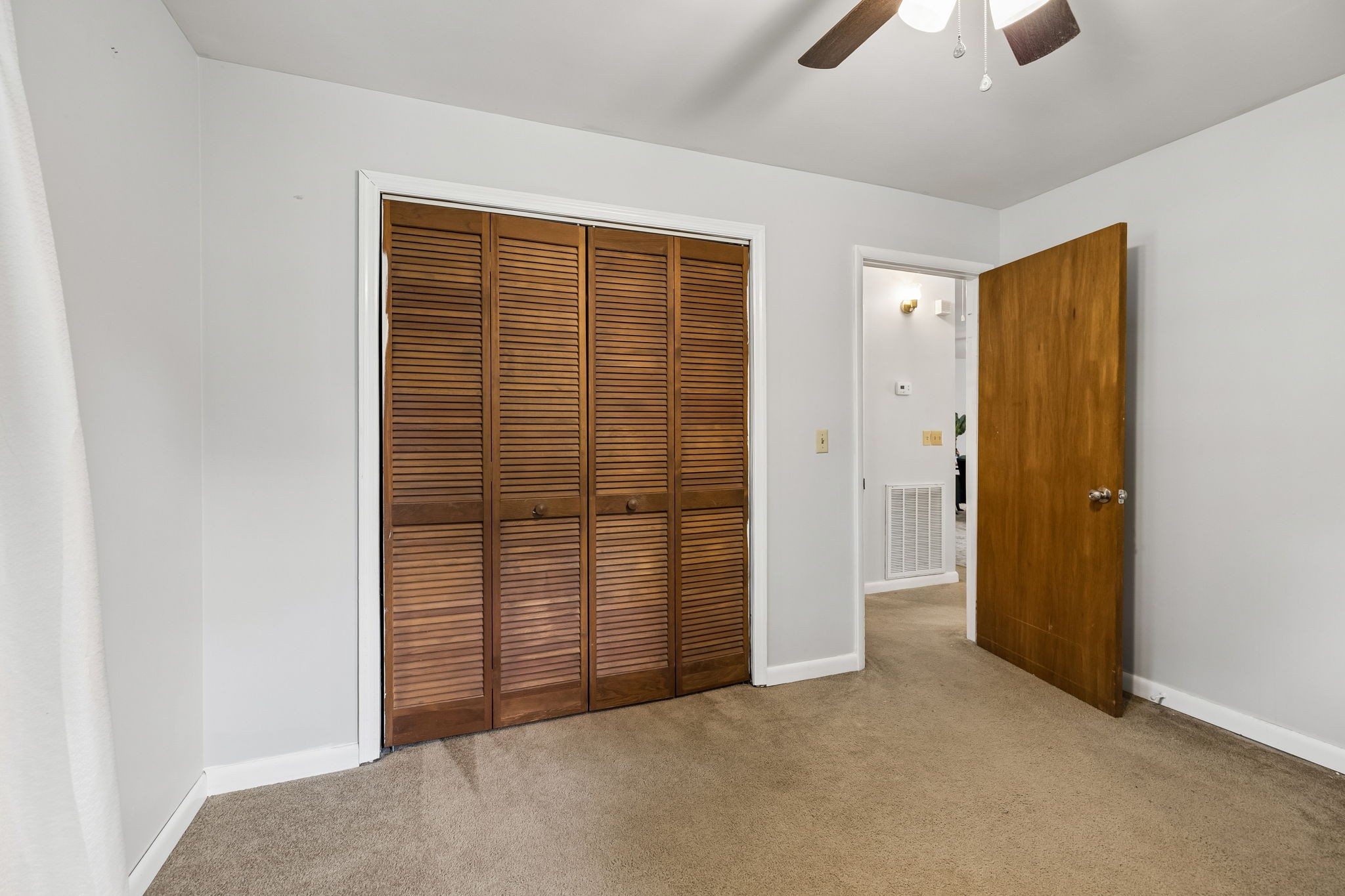 115 1st Street Monteagle, TN 37356 - Photo 16 of 22 an empty room with closet and chandelier fan