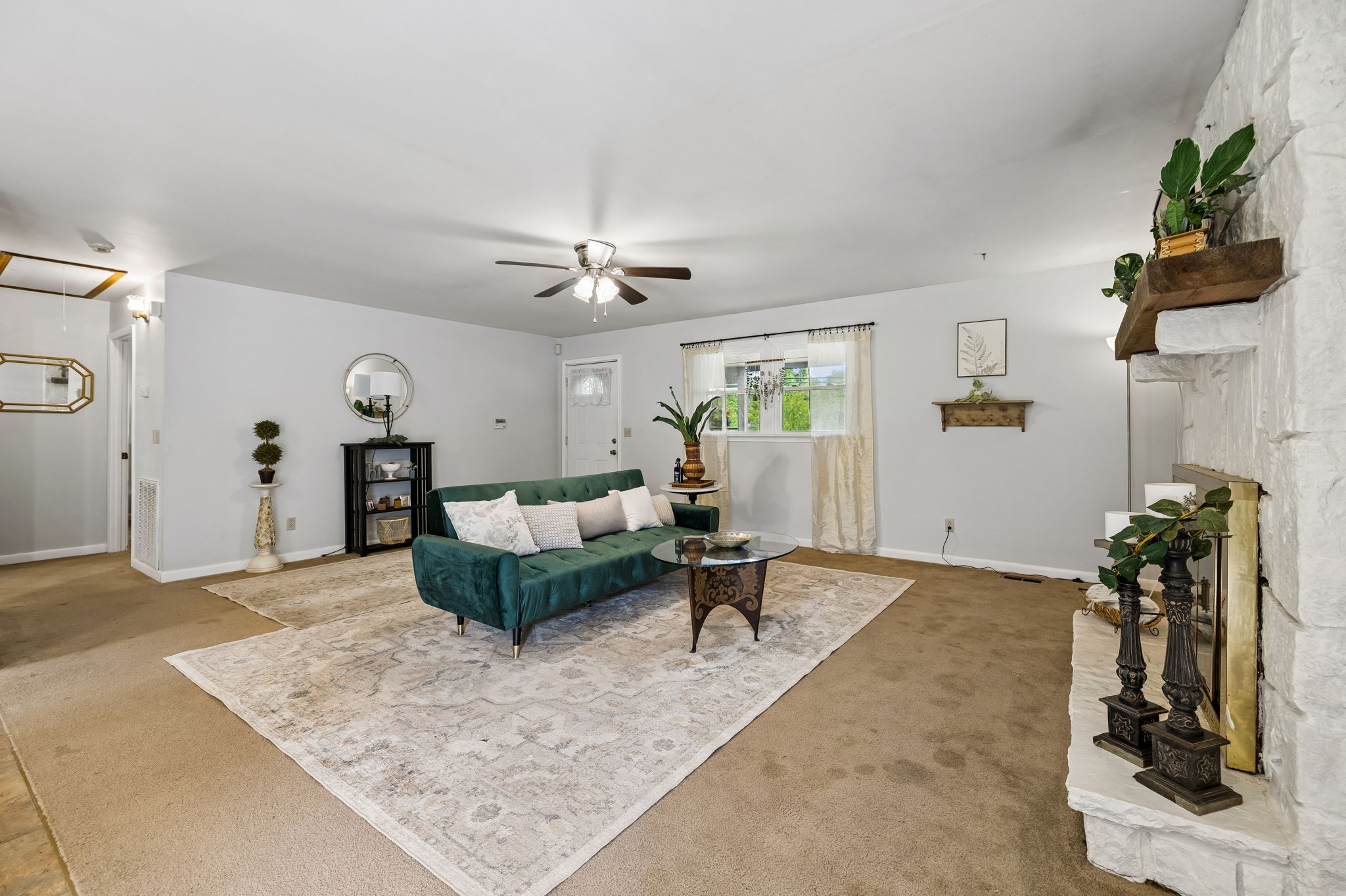 115 1st Street Monteagle, TN 37356 - Photo 7 of 22 a living room with furniture and a chandelier