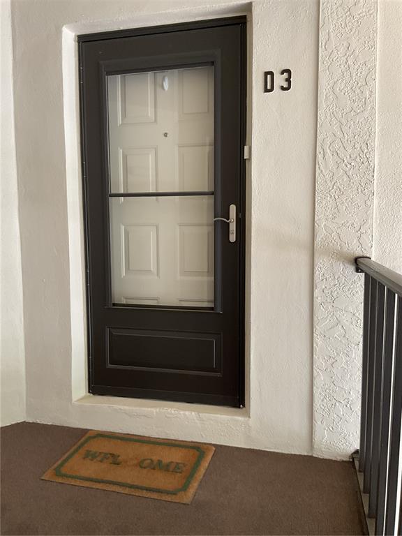 2655 Pine Ridge Way North, Unit D3 Palm Harbor, FL 34684 - Photo 1 of 31 a view of front door