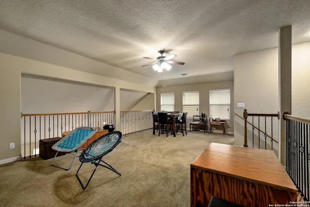 a view of a livingroom with furniture and a table