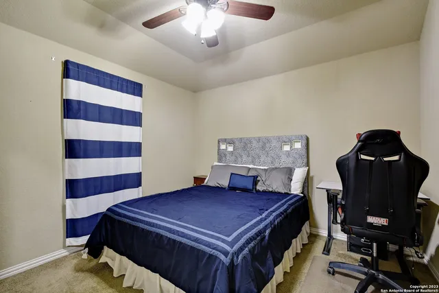 a bedroom with a bed and a chair