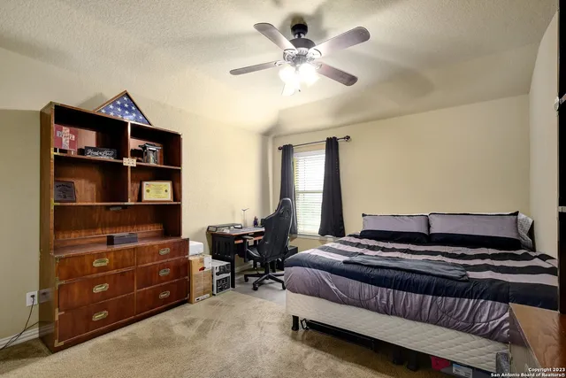 a bedroom with a bed and dresser